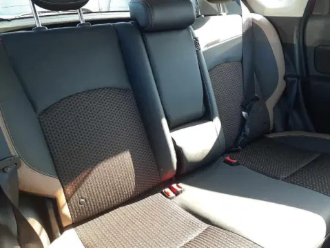 Red Nissan Note e-Power 2017 hatchback, rear seats view.