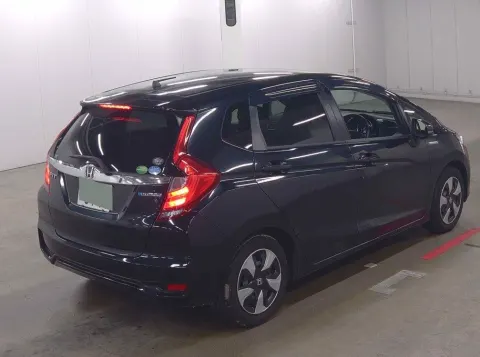 Engine bay of 2017 Honda Fit Hybrid hatchback, 1.5L hybrid engine