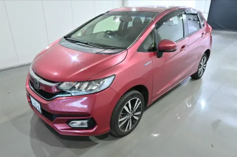 Honda Fit Hybrid 2018 hatchback in pink, front three-quarter view, in Musina.