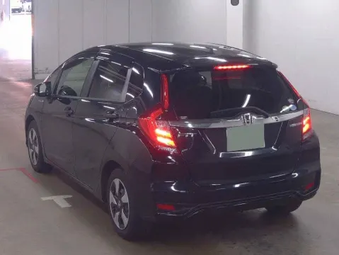 2017 Honda Fit Hybrid hatchback in Pearl Black, rear view, at Musina dealership