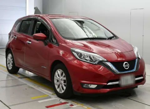 Red Nissan Note e-Power 2017 hatchback, rear three-quarter view.