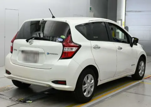 2017 Nissan Note e-Power X white hatchback, rear view, in transit from Japan.