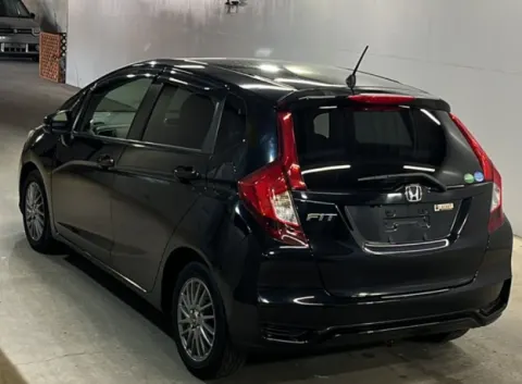 Honda Fit 2017 black hatchback, rear view, fresh import from Japan, at Musina dealership.