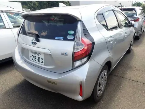 Rear view of a silver 2017 Toyota Aqua hatchback showing the tailgate and rear lights.