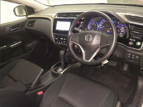 Engine bay of a 2017 Honda Grace sedan, showing the hybrid engine components, at a dealership in Musina.