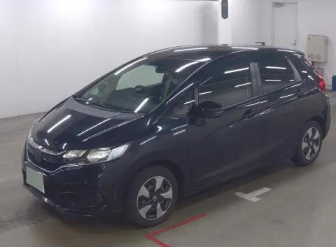 Interior of 2017 Honda Fit Hybrid hatchback, dashboard and seats