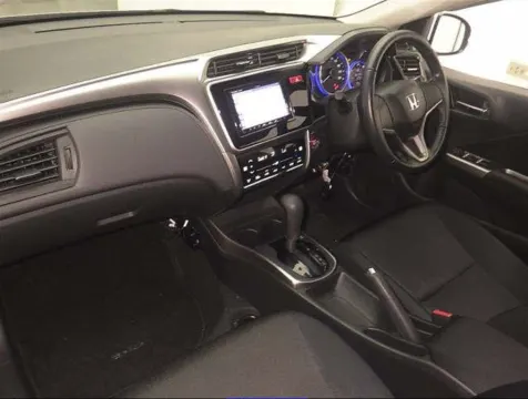 Interior view of a 2017 Honda Grace sedan, showing the dashboard and seats, at a dealership in Musina.