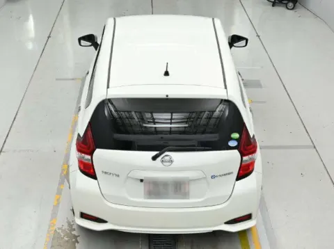 2017 Nissan Note e-Power X white hatchback, rear three-quarter view, in transit from Japan.