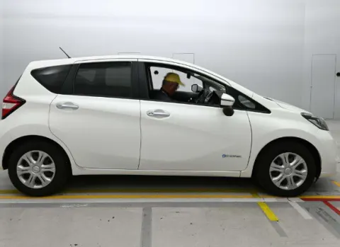 2017 Nissan Note e-Power X white hatchback, side profile, in transit from Japan.