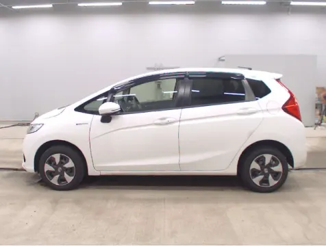 Interior view of a 2018 Honda Fit Hybrid showing dashboard and seats.