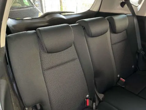 White Honda Fit 2018 hatchback, rear three-quarter view, showing hatchback design.